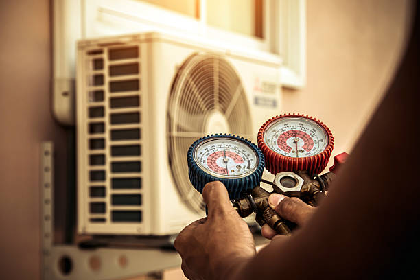Professional Air Conditioning Service technician working in Smithton, PA